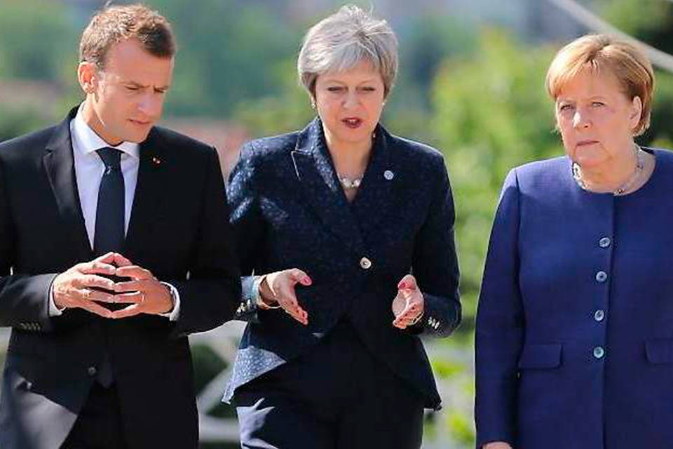 Emmanuel Macron, Teresa May y AngelaMerkel